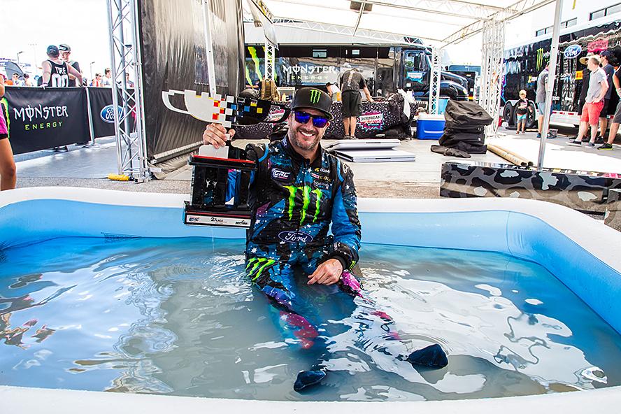 After enduring cockpit temperatures of 140ยบ F in the racecar, Ken Block takes his trophy straight to his kids' pool at the team service area after GRC Round 3 in Daytona, Florida.