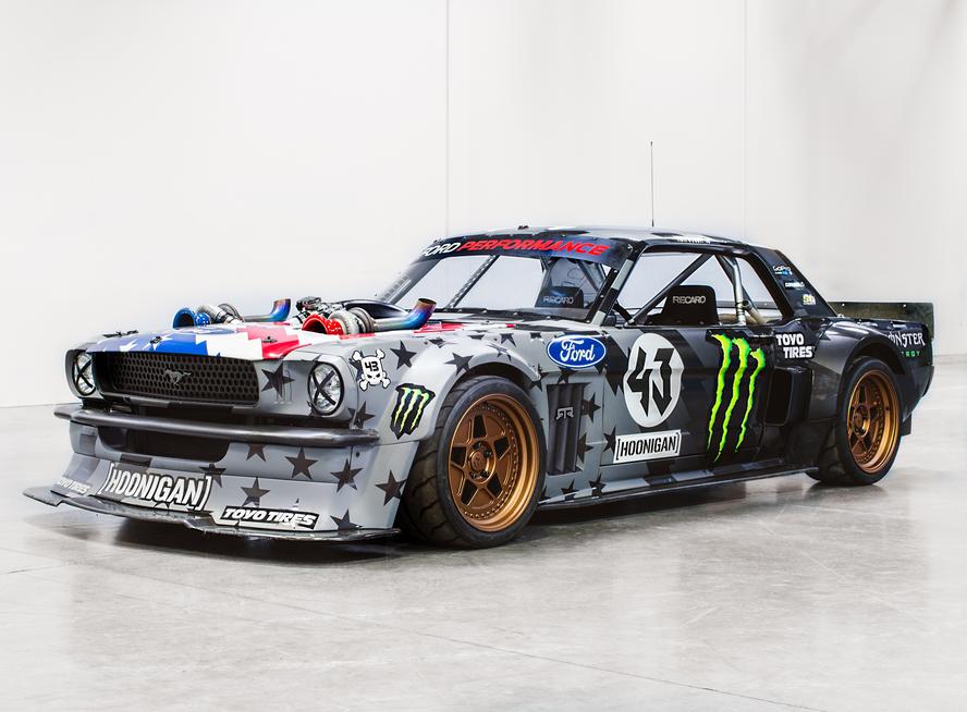 Just when you thought that one of the most iconic custom car builds of the last decade couldn’t get any better, Ken Block and Hoonigan have gone and improved upon the perfection that was Block’s 1965 Ford Mustang Hoonicorn RTR from Gymkhana SEVEN. How you ask? By adding two turbos to the equation and adding methanol.