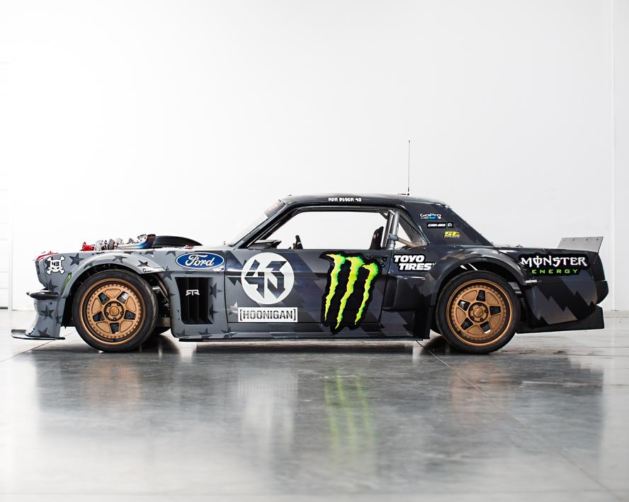 Just when you thought that one of the most iconic custom car builds of the last decade couldn’t get any better, Ken Block and Hoonigan have gone and improved upon the perfection that was Block’s 1965 Ford Mustang Hoonicorn RTR from Gymkhana SEVEN. How you ask? By adding two turbos to the equation and adding methanol.