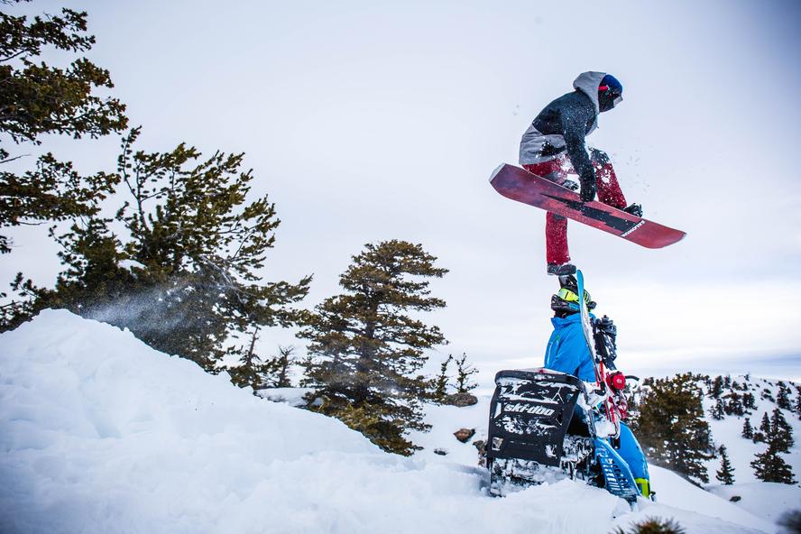 Last winter, Ski-Doo sent the HHIC, Ken Block a few Ski-Doo Freestyles and Summits to use and rip around the mountains of Utah. So, Block invited professional Ski-Doo ambassadors Carl Kuster and Ashley Chaffin out to join him and show him just how hard you can push a sled. And, since Block in-part comes from the snowboarding world, he also made sure to invite a few pals that can snowboard as well: Olympic Gold Medalist Sage Kotesnburg and last season's Rider of the Year, Bode Merrill.