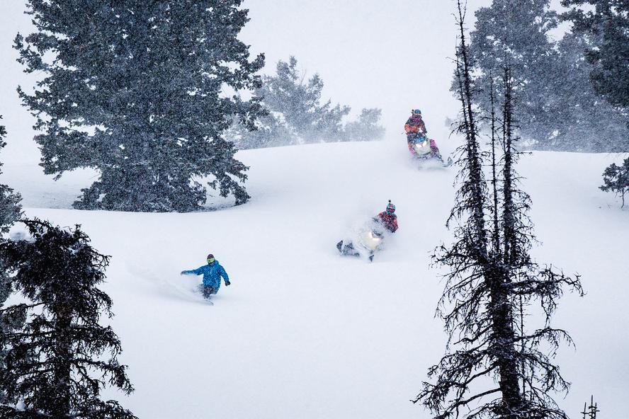 Last winter, Ski-Doo sent the HHIC, Ken Block a few Ski-Doo Freestyles and Summits to use and rip around the mountains of Utah. So, Block invited professional Ski-Doo ambassadors Carl Kuster and Ashley Chaffin out to join him and show him just how hard you can push a sled. And, since Block in-part comes from the snowboarding world, he also made sure to invite a few pals that can snowboard as well: Olympic Gold Medalist Sage Kotesnburg and last season's Rider of the Year, Bode Merrill.